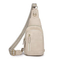 Women's soft brown PU leather crossbody chest bag with an open front pocket.