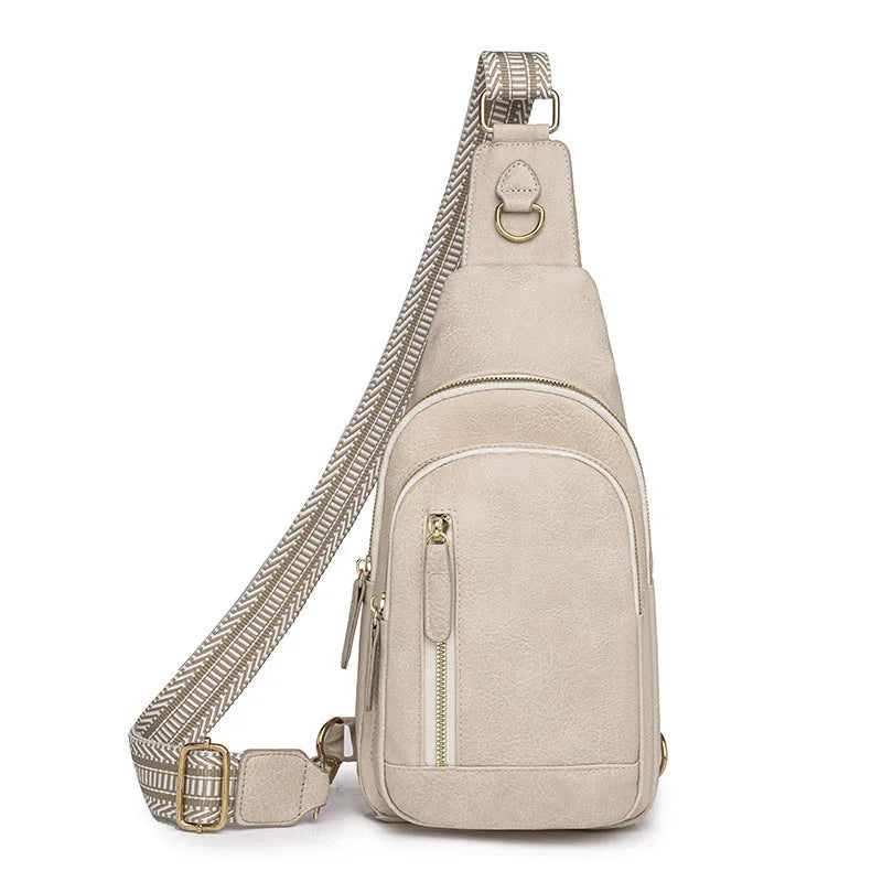 Women's soft brown PU leather crossbody chest bag with an open front pocket.