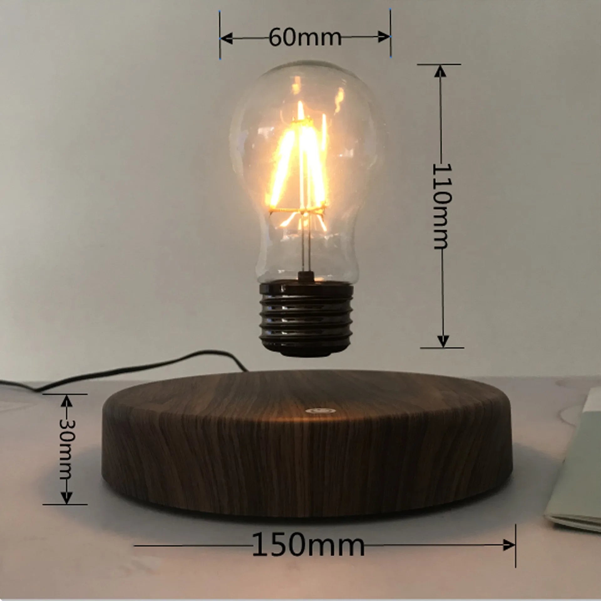 Magnetic levitation bulb night light floating above solid wood colour base with plug adapter options