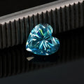 Colourful heart-shaped moissanite gemstones in red, blue, yellow, and pink for jewellery making.