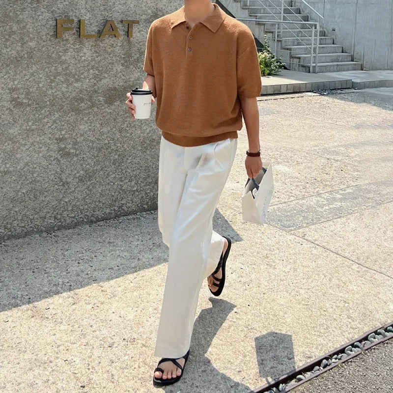 A caramel-colour men's retro knitted polo shirt with short sleeves, showing its loose fit and asymmetric design detail.
