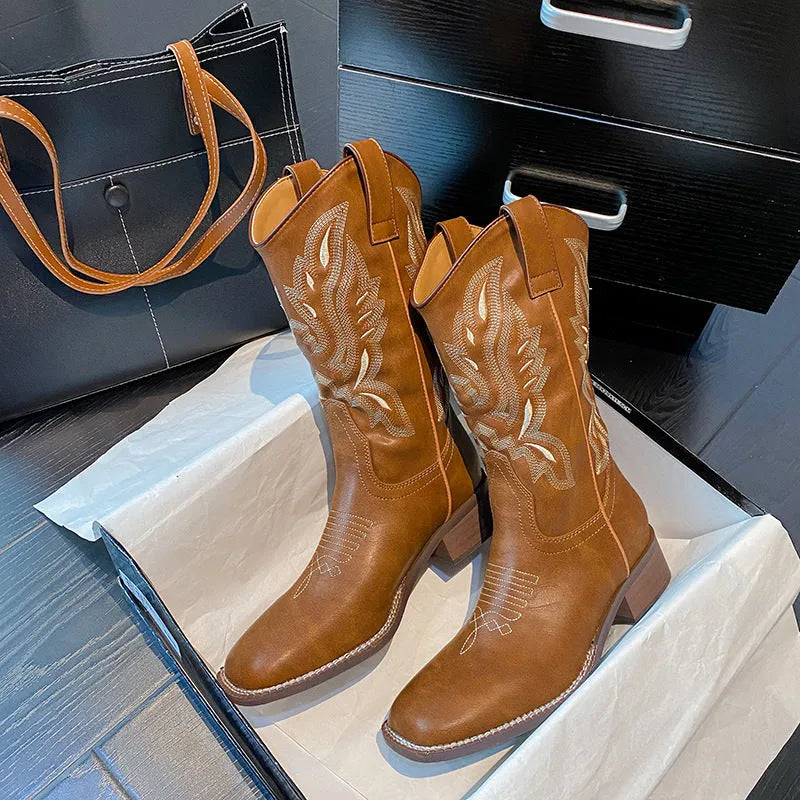Brown women's mid-calf Martin boots with embroidery and a square low heel.