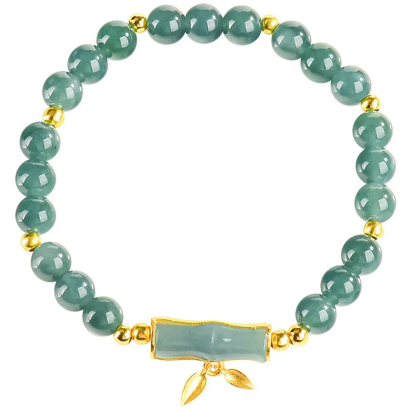 S925 sterling silver bracelet for women with a blue water round bead and cargo jade charm.