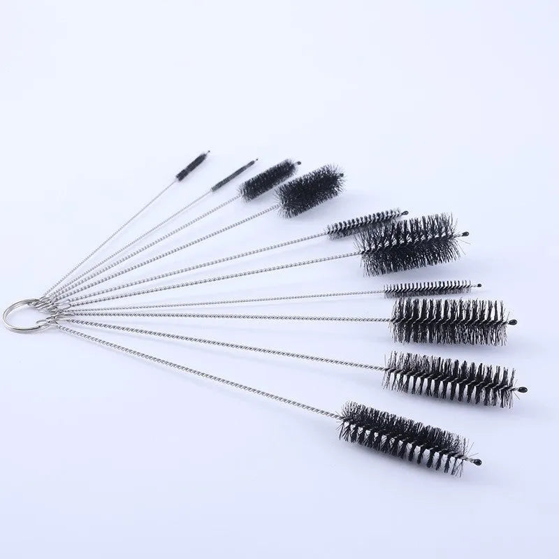 Set of thin stainless steel cleaning brushes with nylon bristles for cleaning drinking straws and bottles.