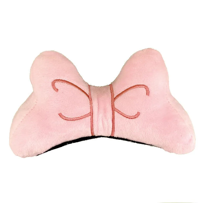 Soft plush red bow tie decoration for tying onto a motorcycle or ski helmet.