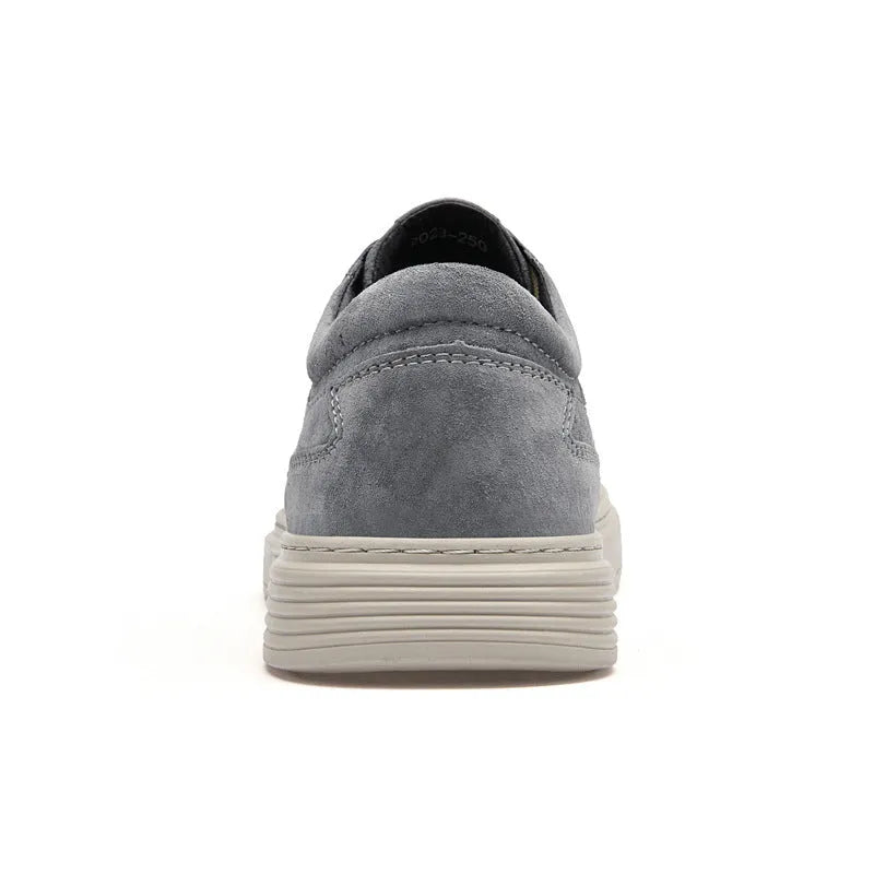 Men's grey pigskin leather low-top casual skate shoes with a round toe and rubber sole on a white background.