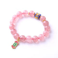Pink crystal bracelet with hand-woven design featuring Ruyi charm and text elements