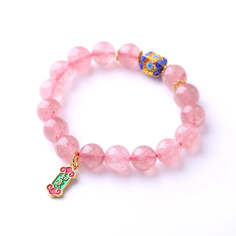 Pink crystal bracelet with hand-woven design featuring Ruyi charm and text elements