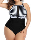 Women's black lace one-piece swimsuit on a hanger, showing front design.
