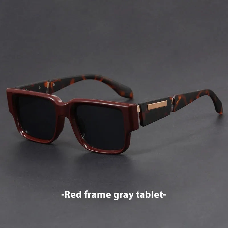 Blue frame retro square sunglasses with grey blue lenses and thick arms.