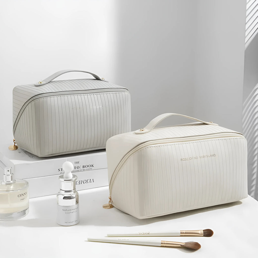 Vertical stripe pattern cubic makeup bag in PU material measuring 22.5cm wide