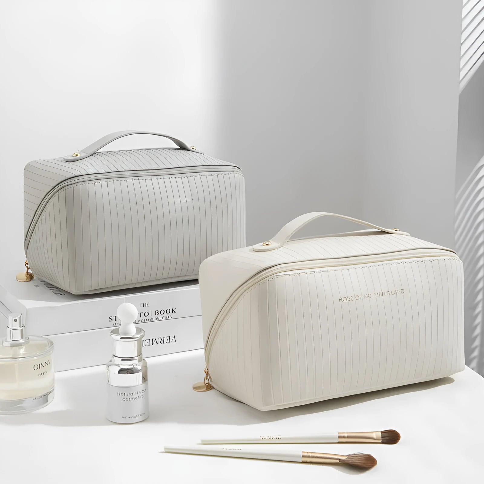Vertical stripe pattern cubic makeup bag in PU material measuring 22.5cm wide