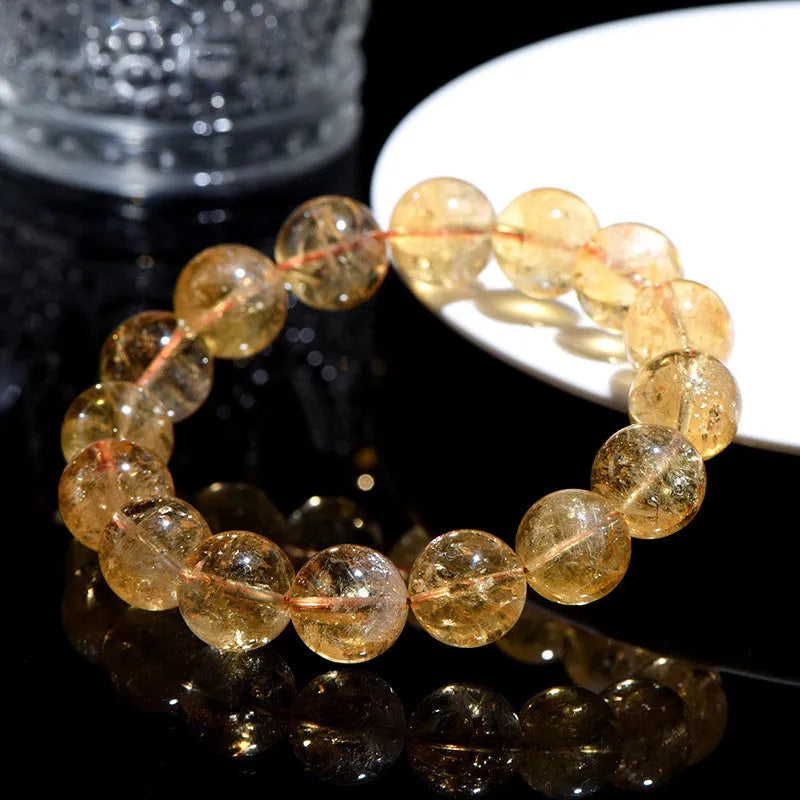 Natural yellow citrine bracelet with spherical beads in Brazilian yellow and violent yellow colour options