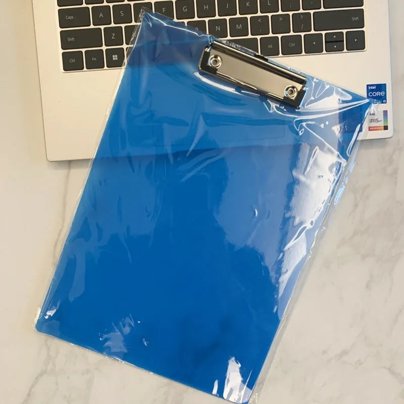 A4 transparent polypropylene clipboard with metal clip, shown in blue, holding paper.