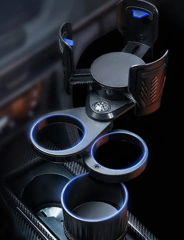 Black retractable car cup holder with adjustable base on a car dashboard.