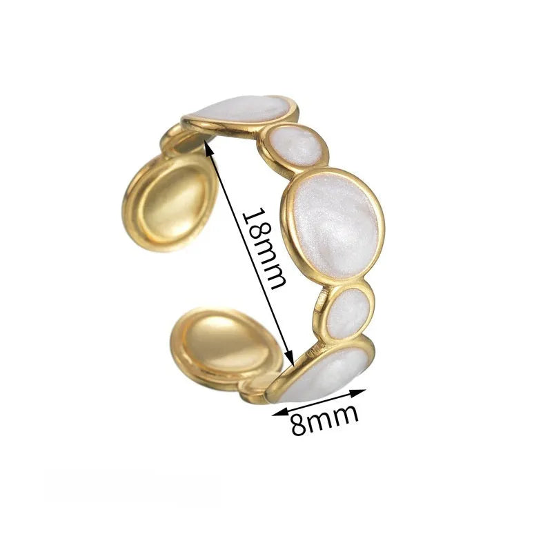 A geometric adjustable ring for women made of electroplated stainless steel on a plain background.