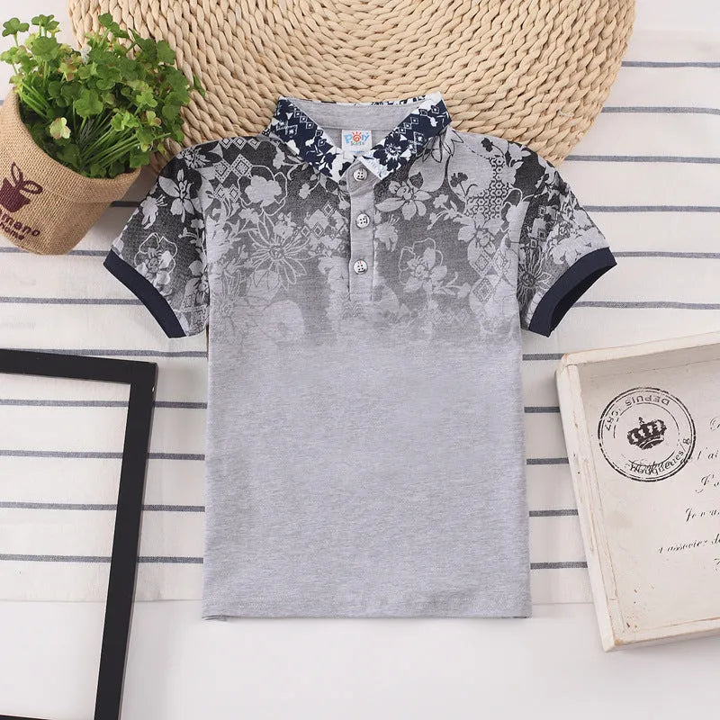 Boys' solid colour cotton short sleeve shirt with lapel collar on hanger.