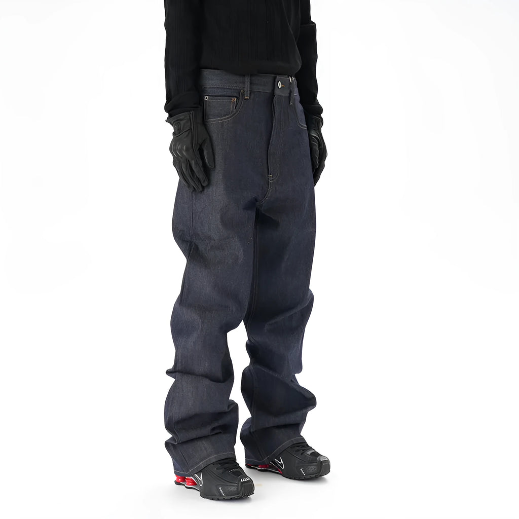 A pair of dark blue loose-fit straight leg jeans on a neutral background.