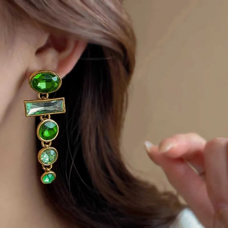 A pair of retro green gradient alloy earrings with a geometric tassel shape and inlaid zircon details.