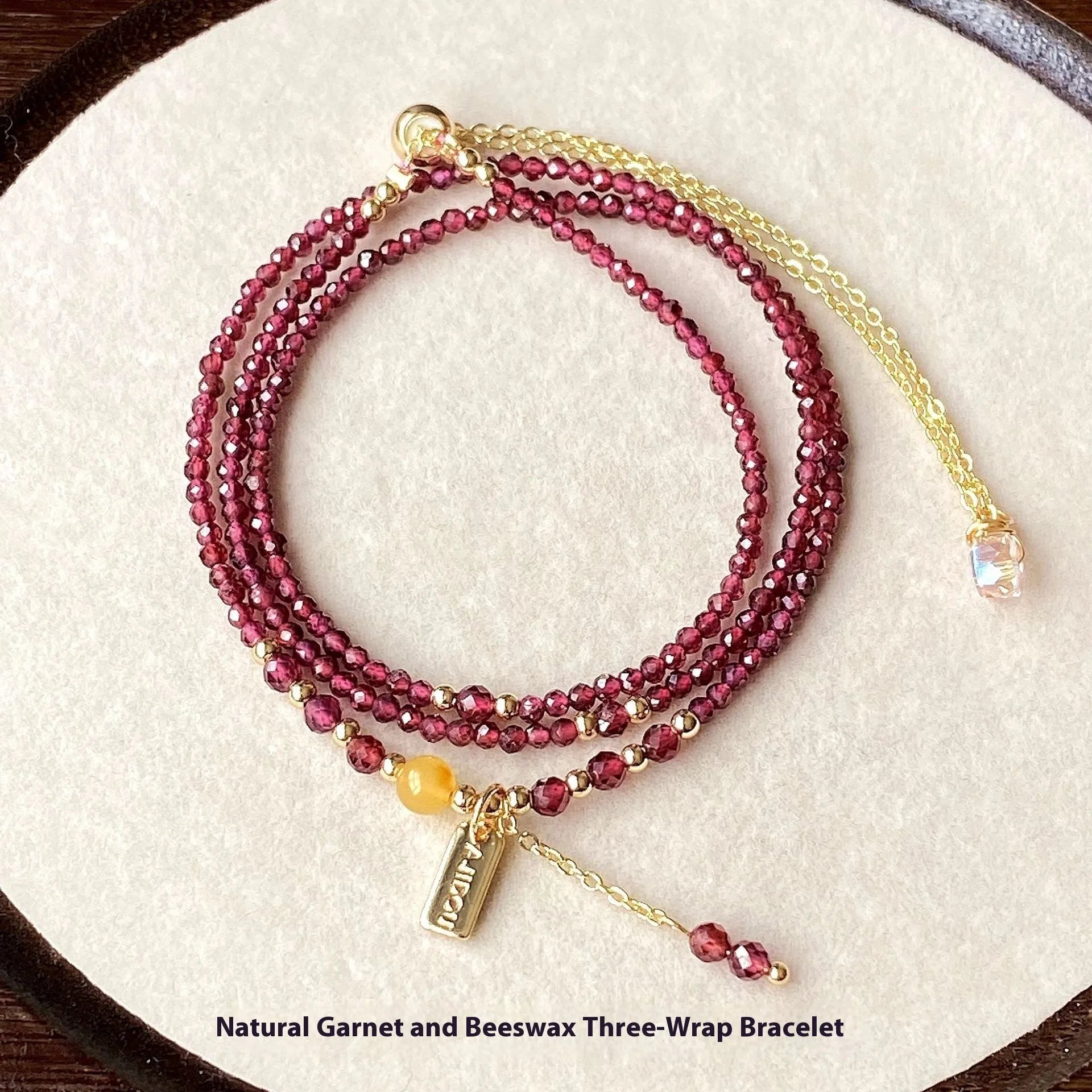 Wine red garnet bracelet with three circle design showing 2.5mm cut stone beads and electroplated metal