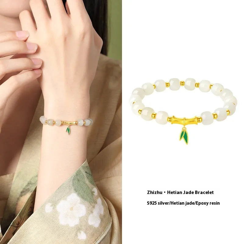 Sterling silver bracelet with gold Hetian jade beads and bamboo leaf charms
