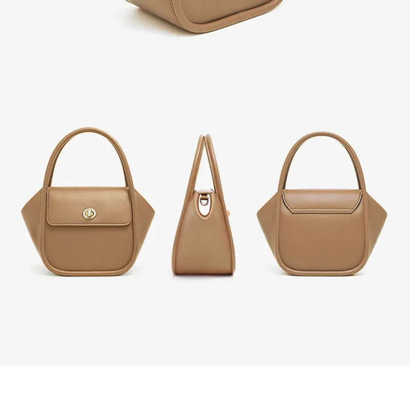 A wing-shaped cow leather women's tote bag with a cross-body strap and latch closure in a choice of colours.