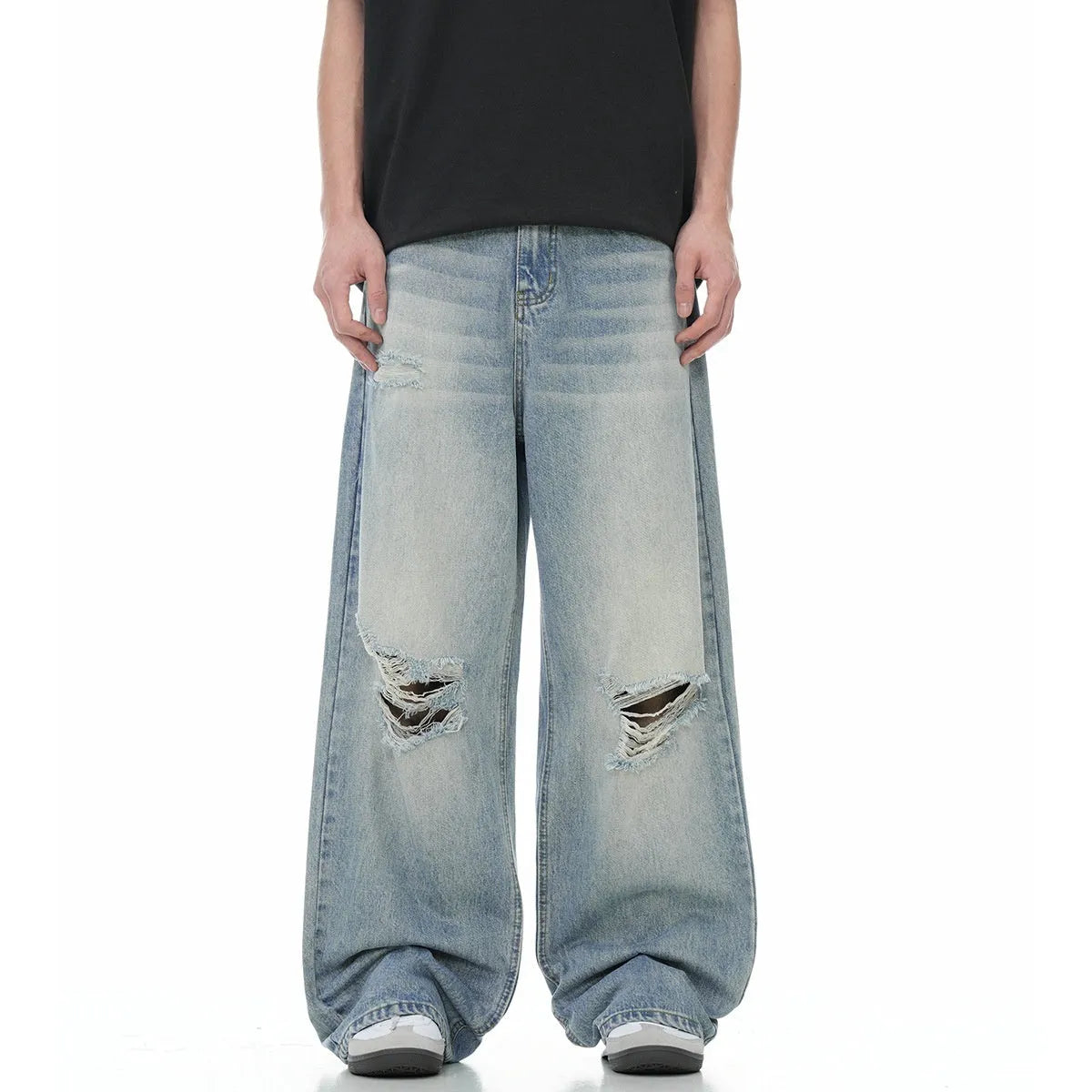 Blue retro-style men's straight-leg jeans with distressed detailing on a solid background