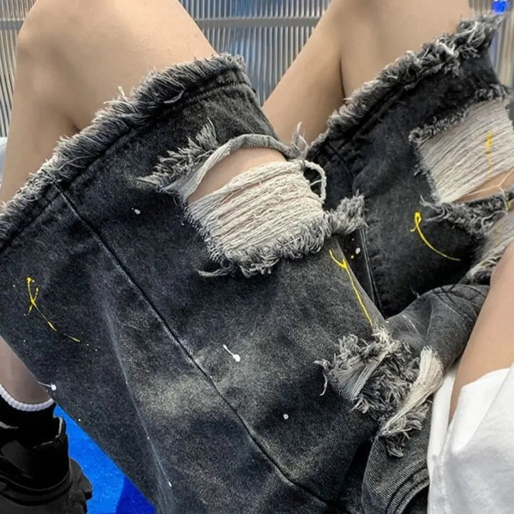 Men's loose fit denim shorts with water-washed finish and hole design in black colour