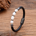 Handmade unisex bracelet with irregular pearls on adjustable leather strap in grey pearl and black.