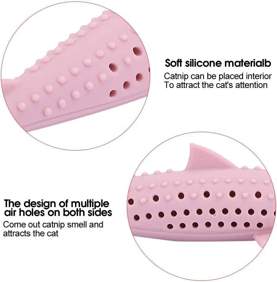 Green dolphin-shaped silicone cat chew toy with side holes on a white background