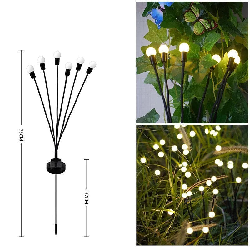 Solar-powered LED garden light with multiple heads on a stainless steel stake, placed in soil.