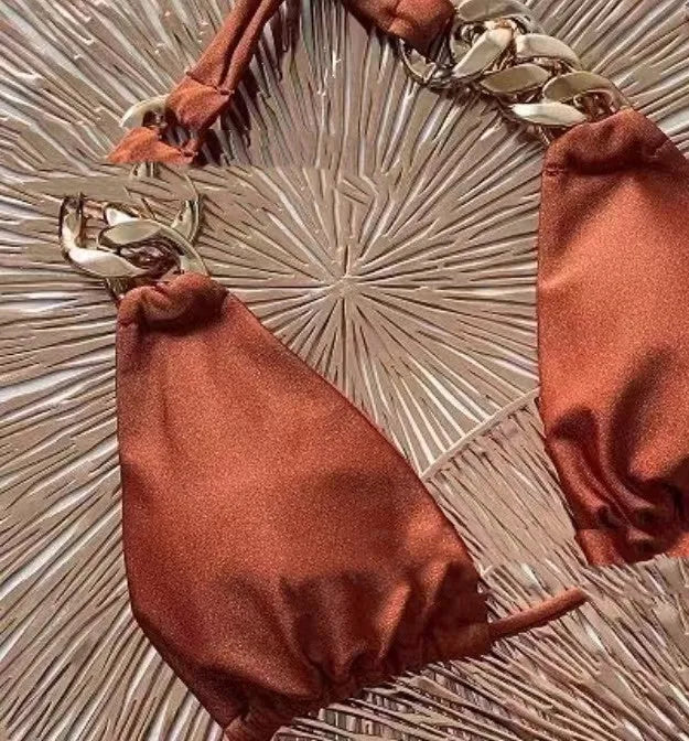 Brown women's tube-top push-up bikini swimsuit with ring tether details.
