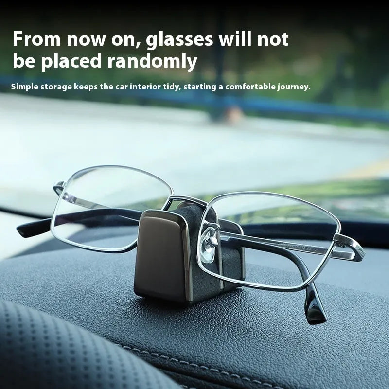 Zinc alloy and leather car dashboard glasses clip holder in green colour.