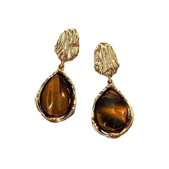 Three pairs of handmade geometric earrings with electroplated alloy construction and tassel detailing