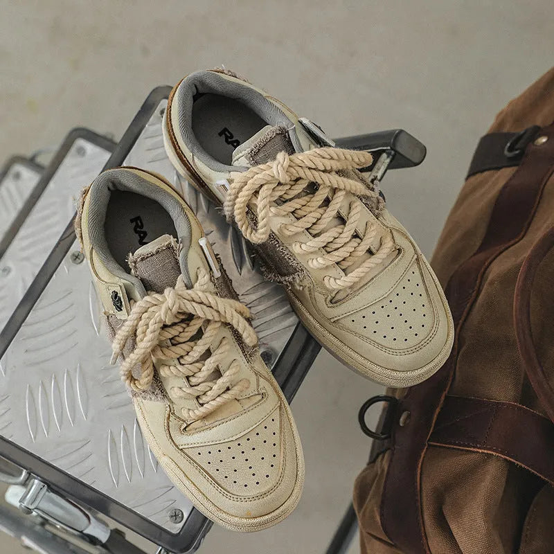 Beige vintage style skateboard sneakers with round toe and rubber sole