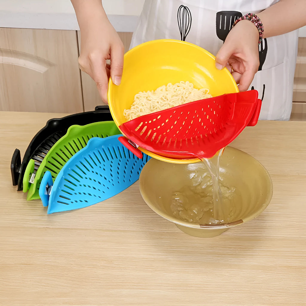 Silicone clip-on kitchen strainer with stainless steel frame attached to pot rim for draining liquids