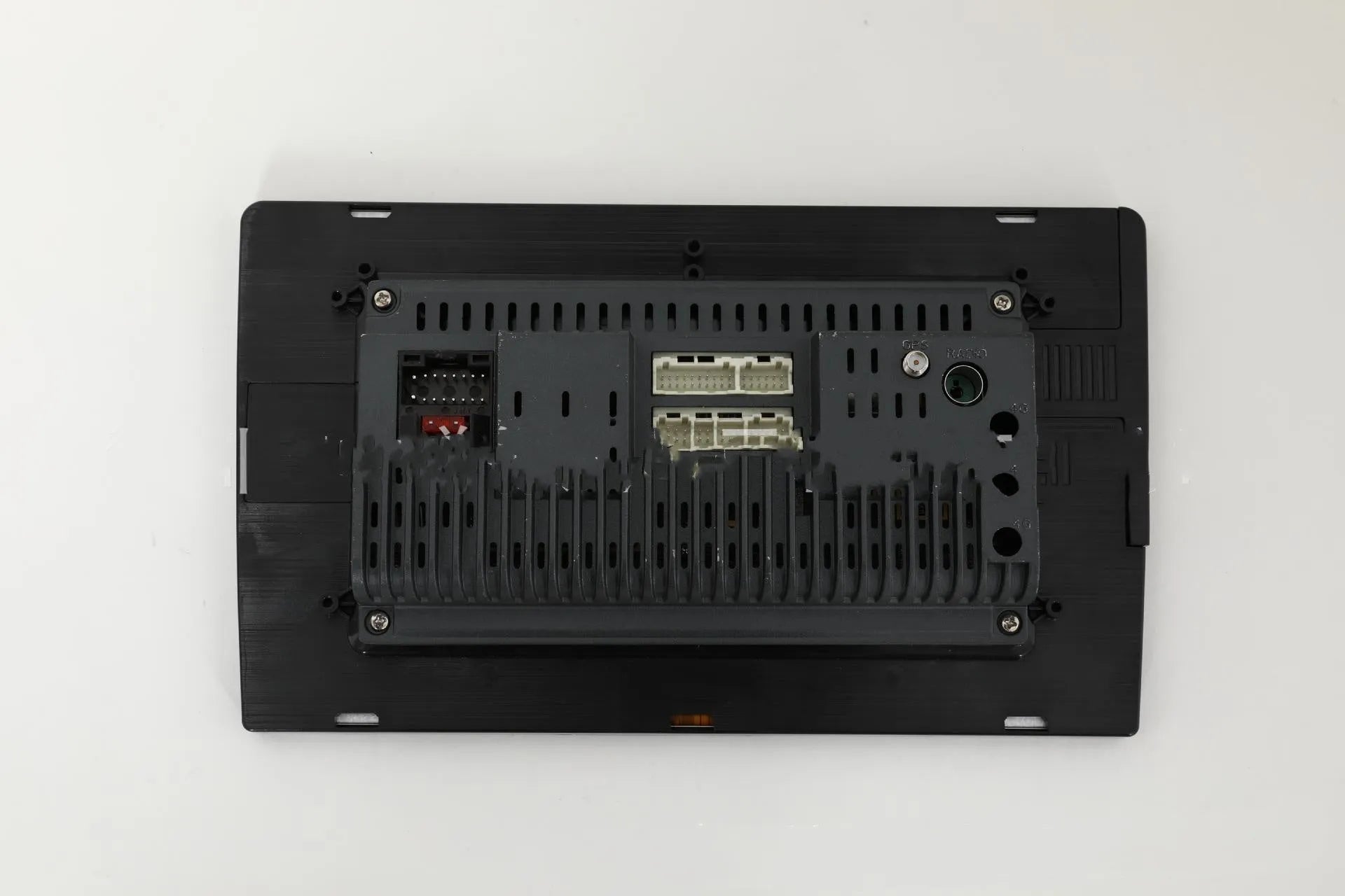 10.1 inch trapezoid Android car stereo head unit with touch screen display on a dashboard