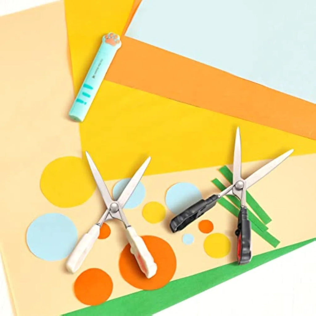 Closed and open views of cute cat paw design mini folding safety scissors on a craft background.