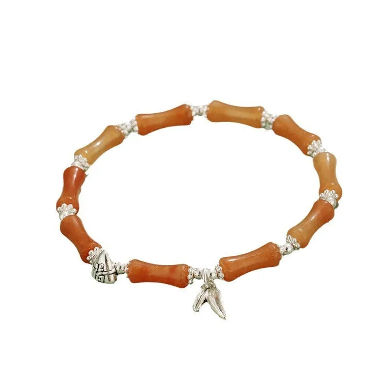 Electroplated bamboo strawberry crystal bracelet for women in green aventurine, showing natural stones on a bracelet.