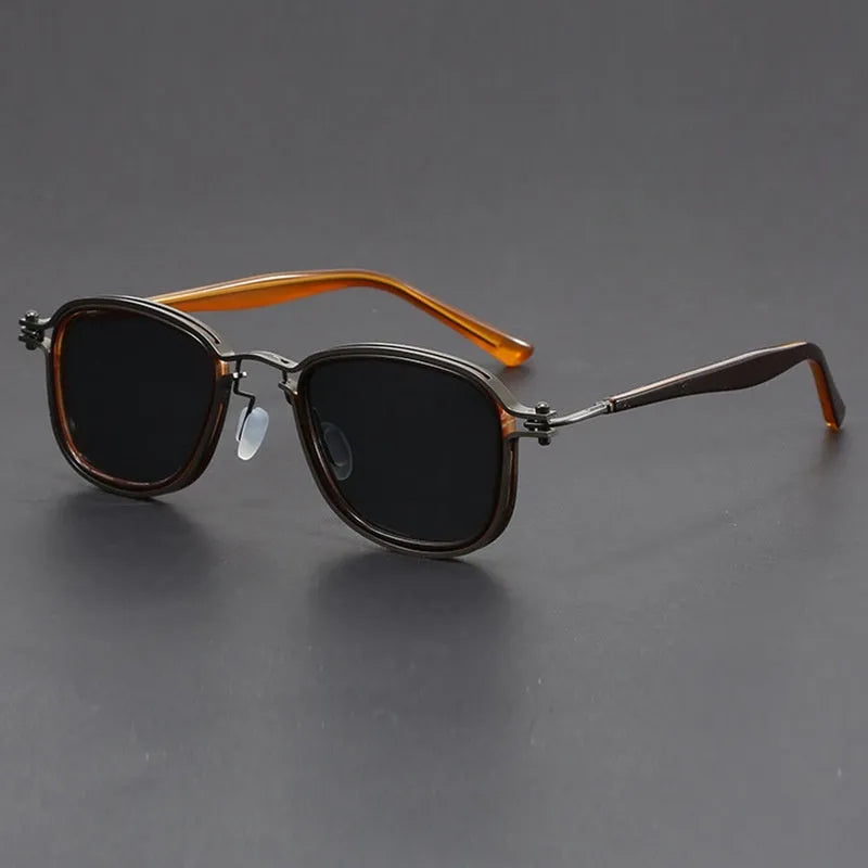 Retro square frame sunglasses with AC lenses in a Black Gold Full Gray colour finish.