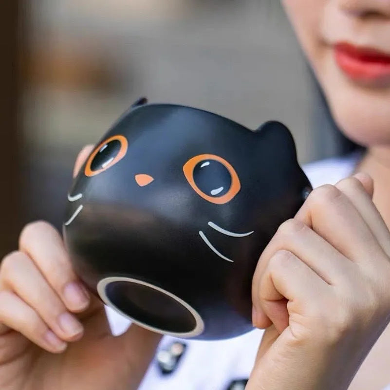 Black ceramic cat-shaped couple mug with pumpkin cover and 355ml capacity.