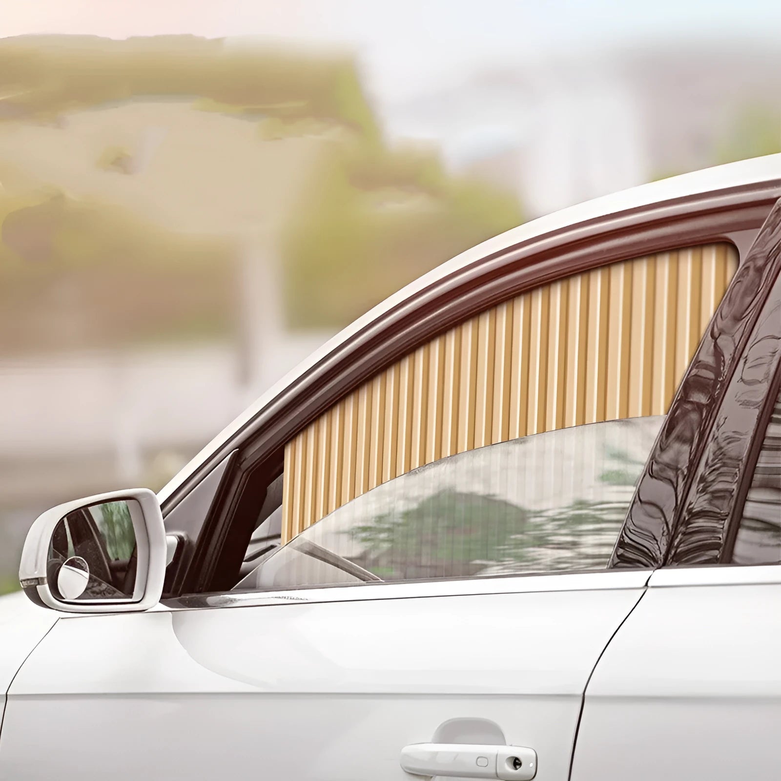 Auto retractable car sun curtain with roller shutter mechanism in black colour extended over vehicle window
