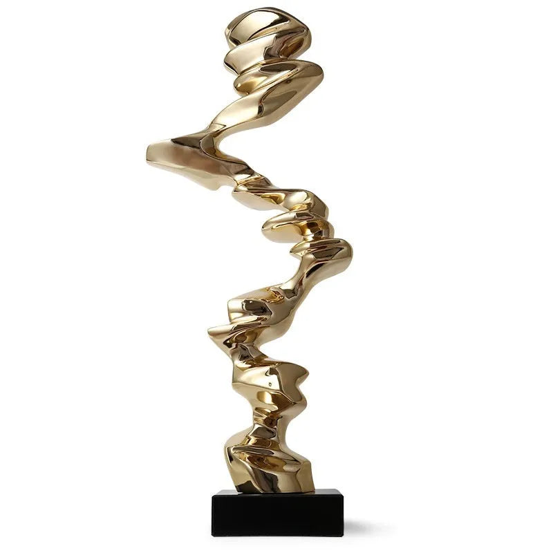 Minimalist abstract still life ornament in natural resin on a shelf, shown in bright gold finish.