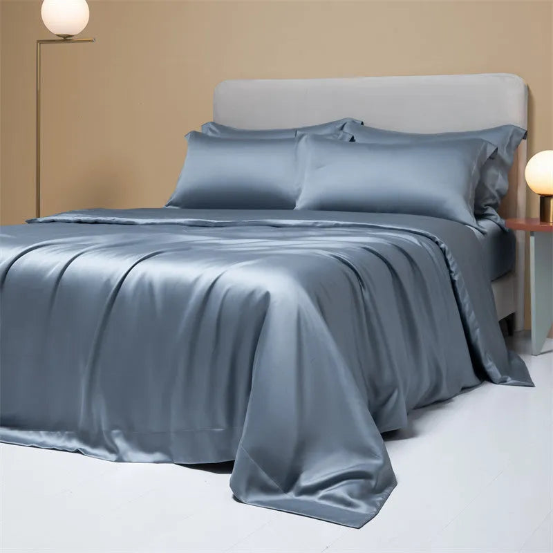 200 thread count Lenzing Tencel quilt cover and sheet set in Aurora Blue, laid on a bed.