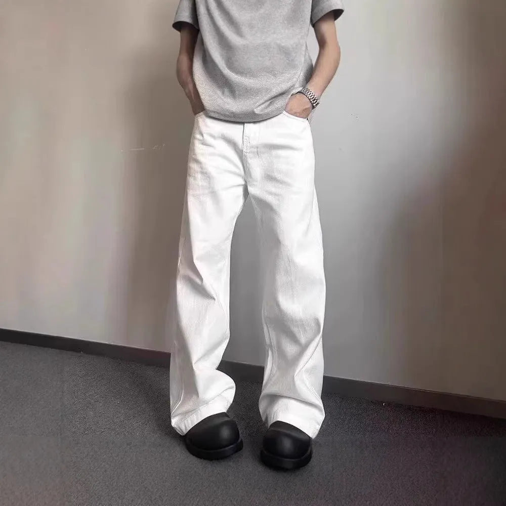 Men's white straight-leg cotton denim jeans on a neutral background.