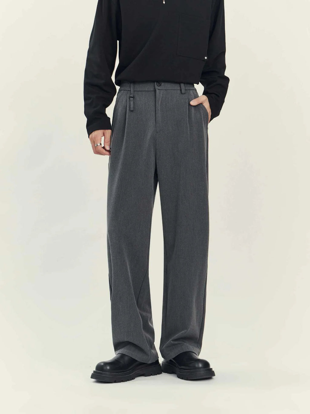 Man's black loose straight-leg business casual trousers made from a draping polyester blend fabric.