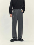 Man's black loose straight-leg business casual trousers made from a draping polyester blend fabric.