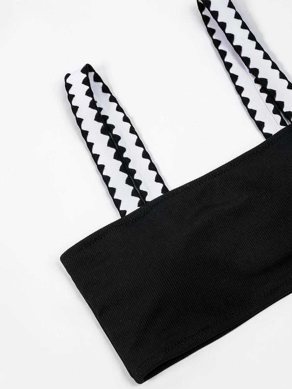 Black women's bikini swimsuit with a hollowed-out split design, showing front and back views.