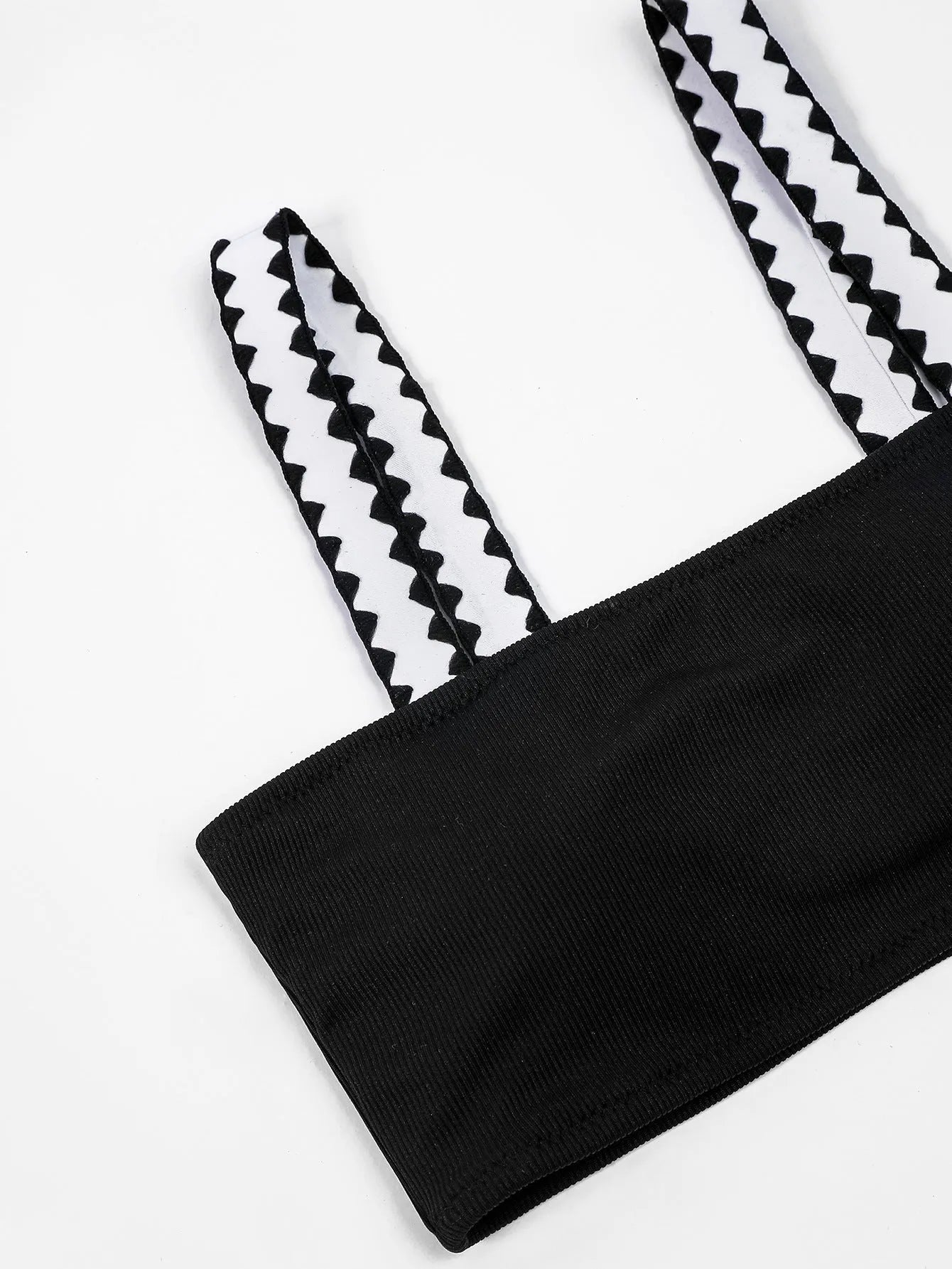 Black women's bikini swimsuit with a hollowed-out split design, showing front and back views.