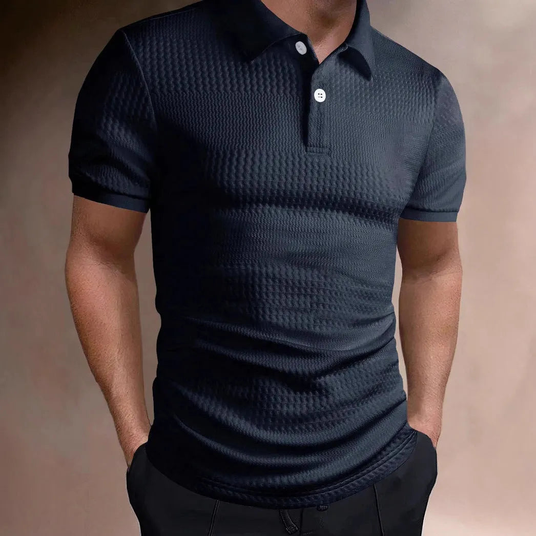 Man wearing a striped loose-fit polo shirt in a light blue colour, suitable for business casual summer wear.